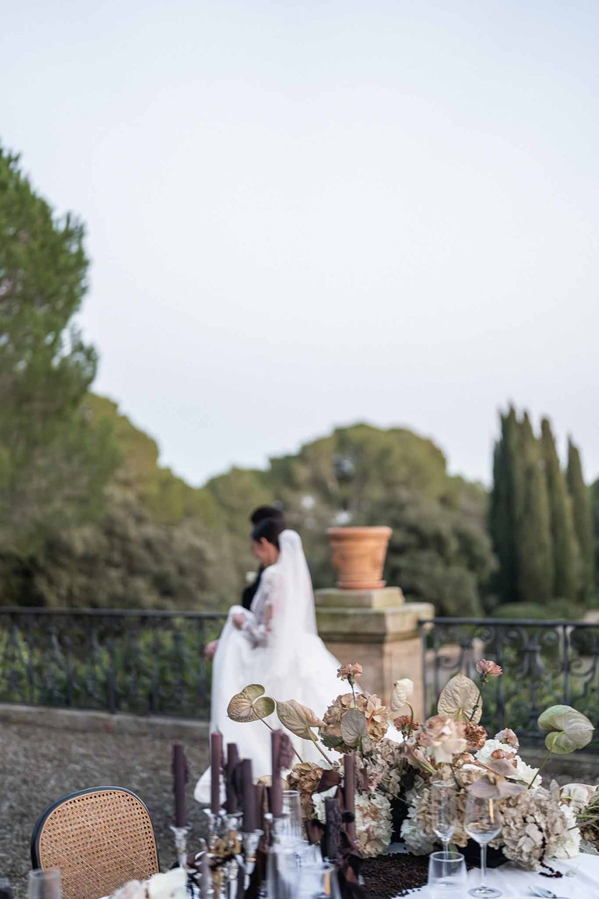 Reception table with dried floral centrepiece at Chateau du Terral terrace