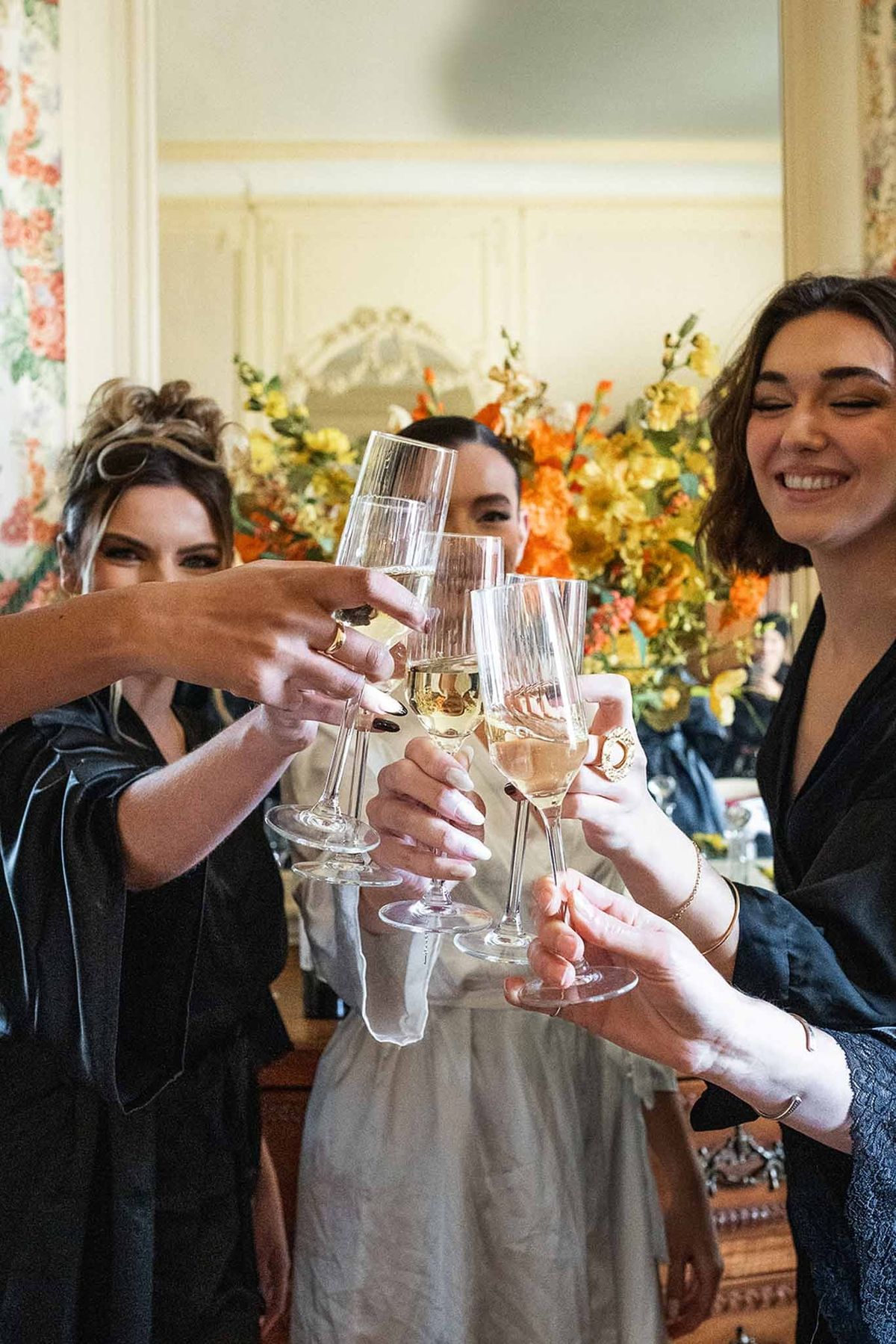 Bridesmaids toasting champagne during getting ready at Chateau du Terral