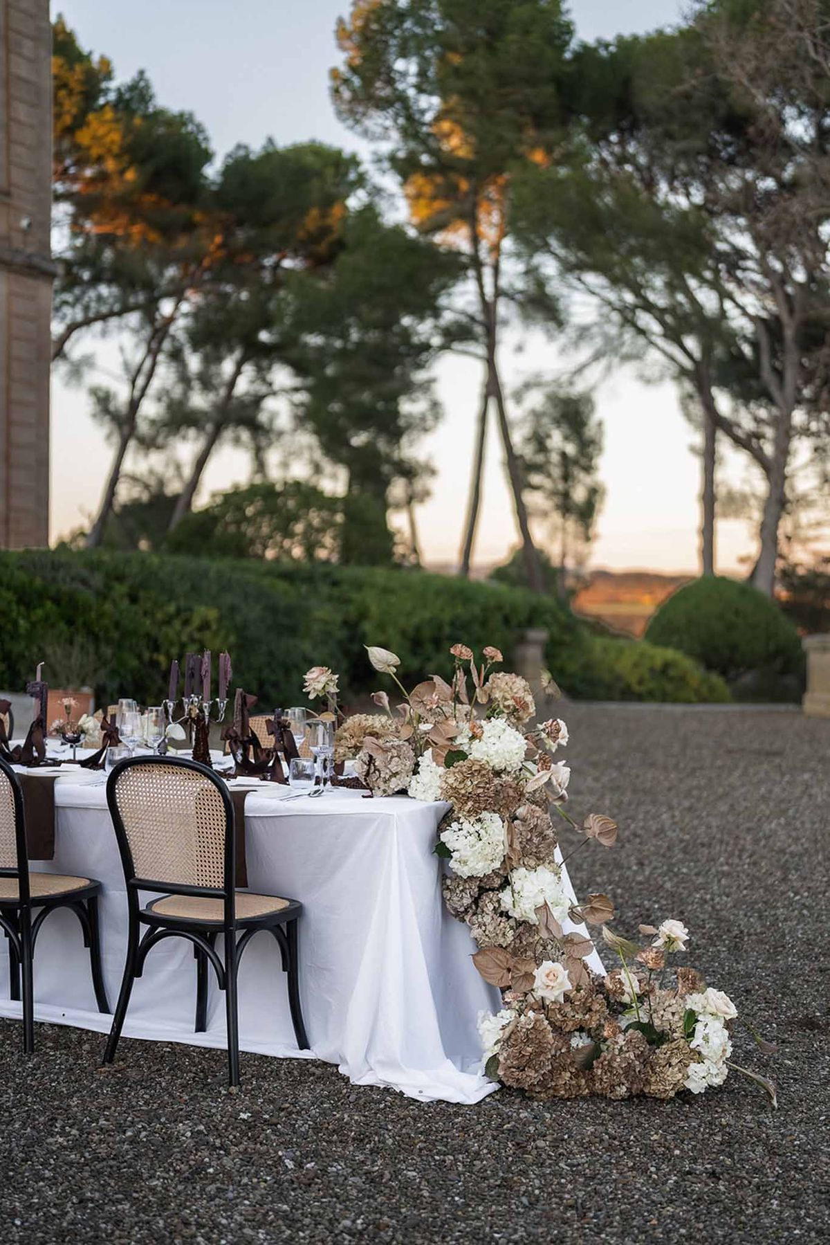 Cascading dried floral arrangement on reception table at Chateau du Terral garden