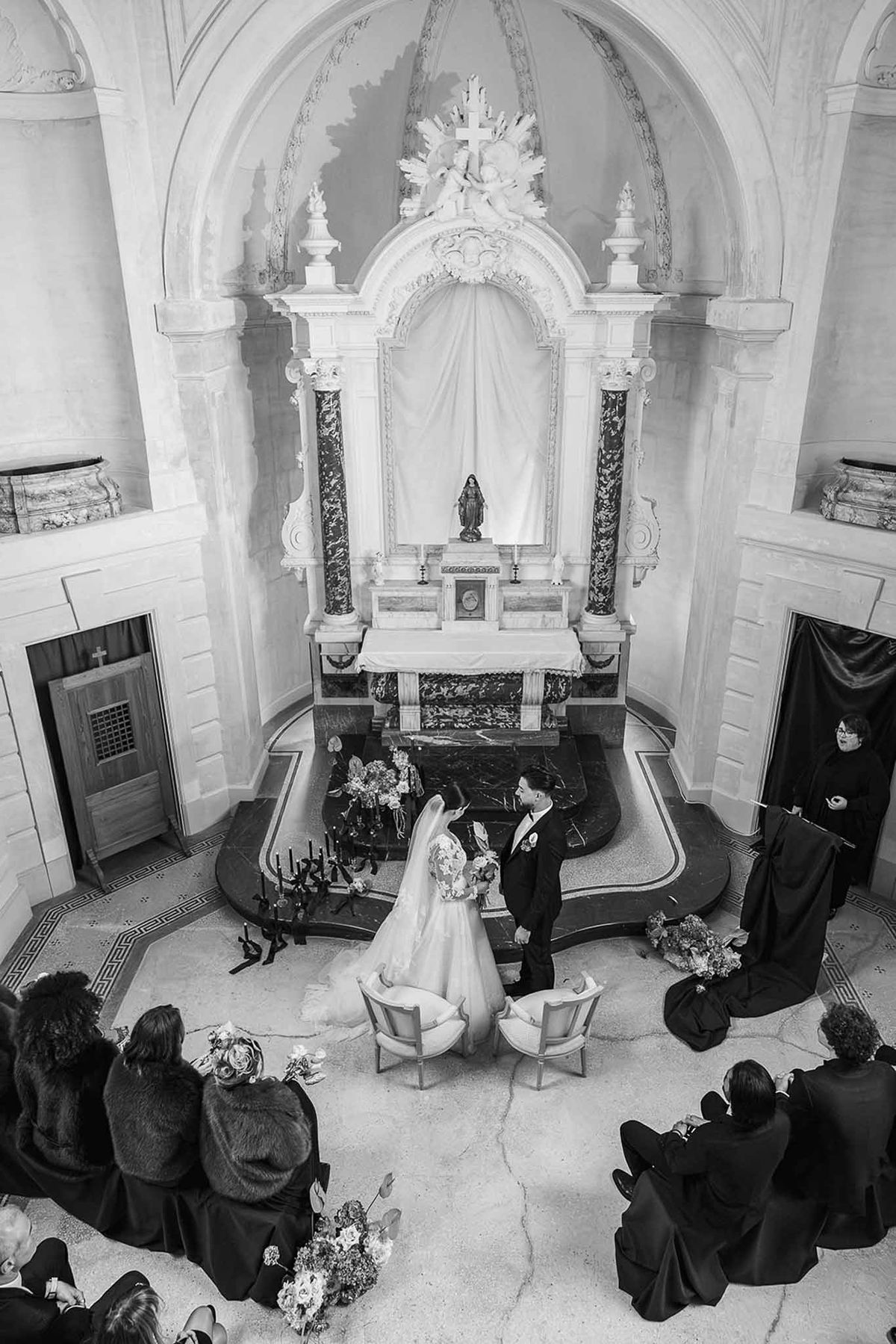 Overhead black and white chapel ceremony with couple at altar Chateau du Terral