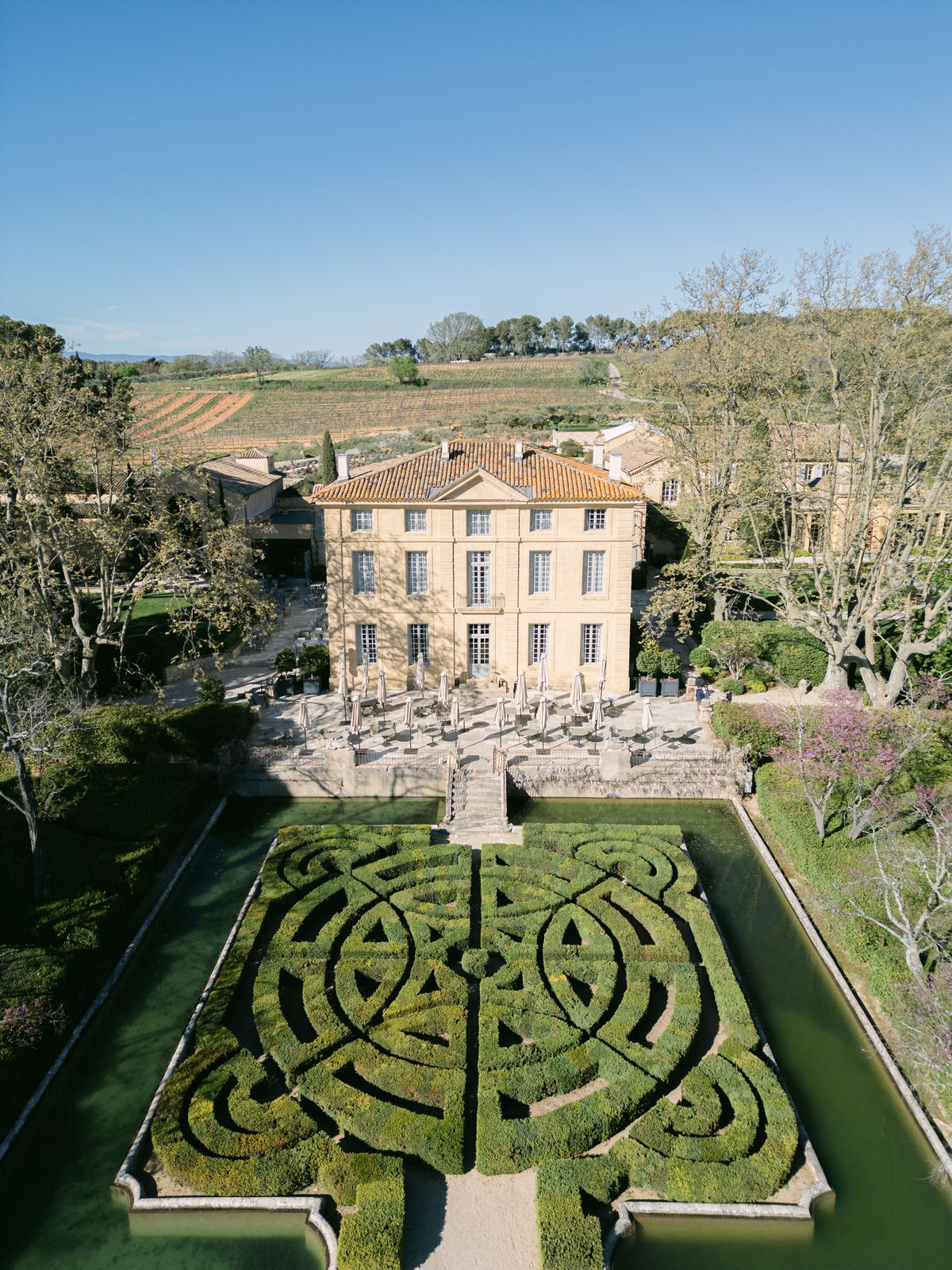 Aerial view of Chateau de la Gaude with its hedge maze and surrounding vineyards