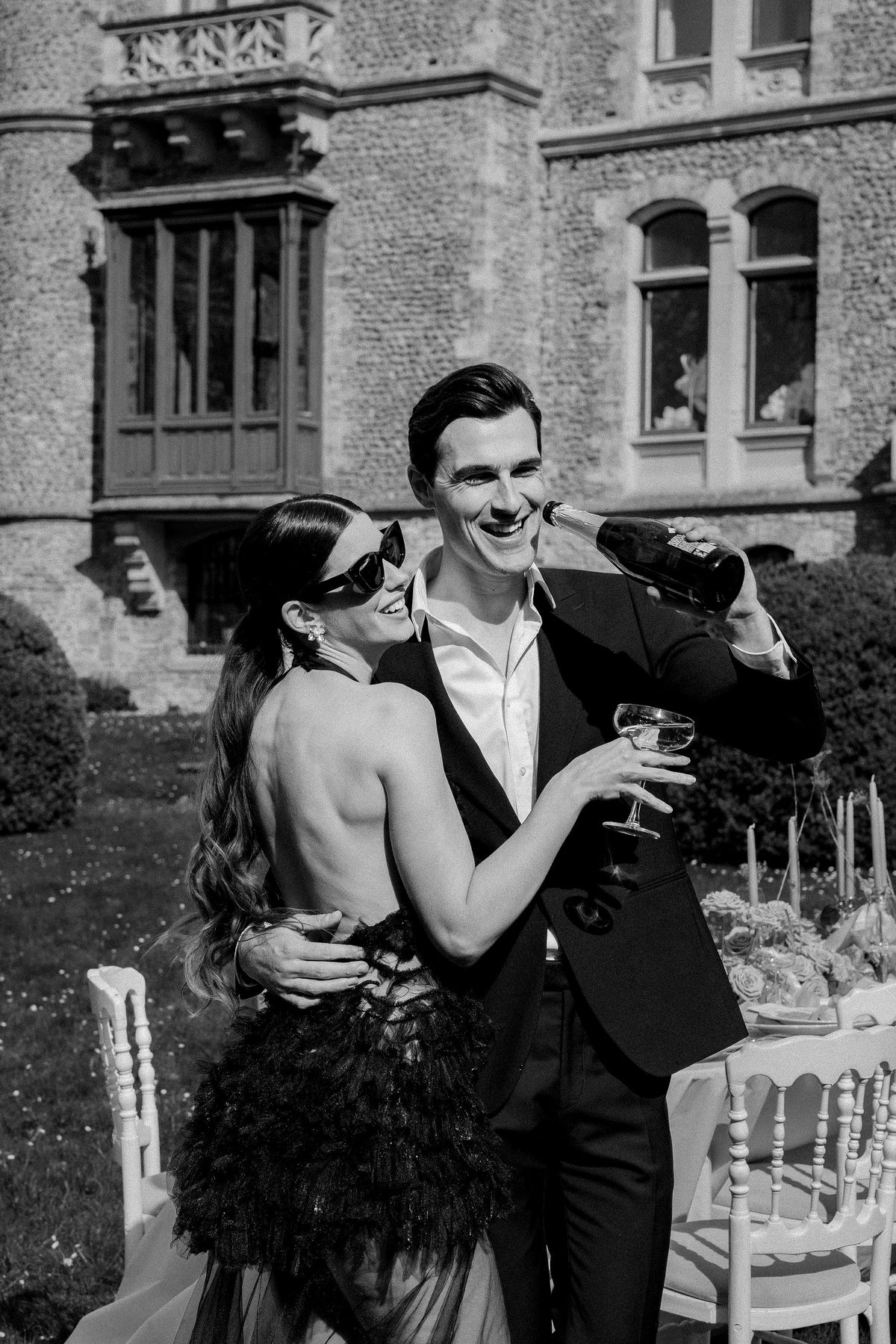 Couple pouring champagne at Château de Méridon, Île-de-France
