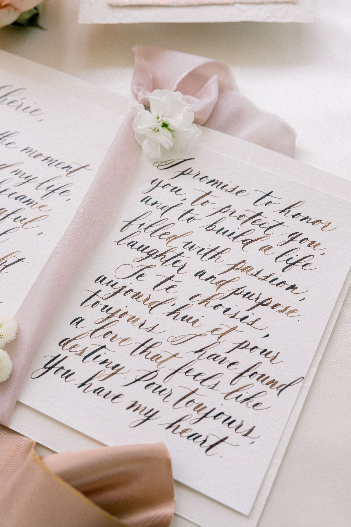 Calligraphed French vows flat-lay at Château de Méridon, Île-de-France