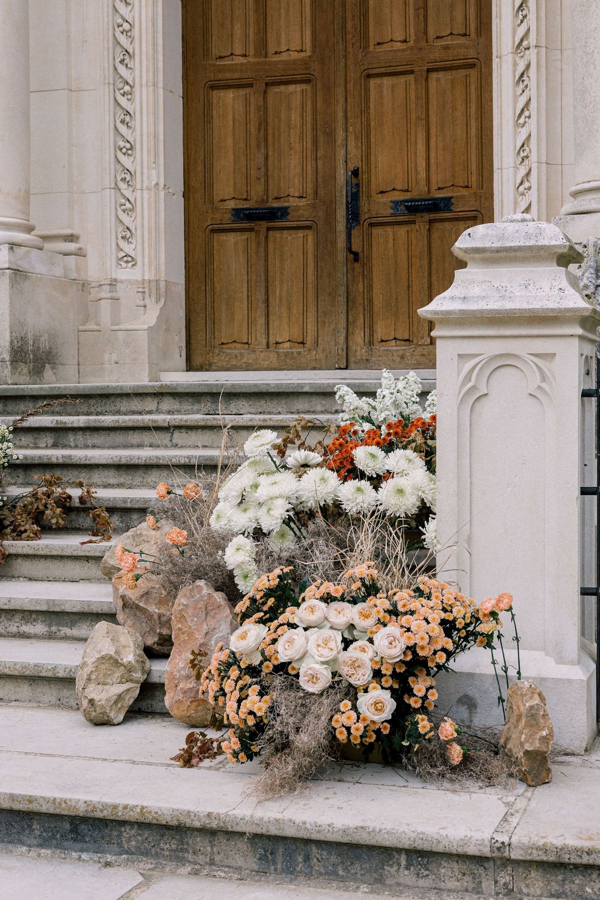 Asymmetric portico floral installation at Château de Méridon, Île-de-France