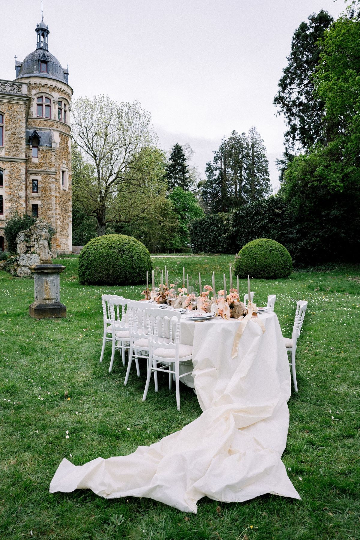 Outdoor dining setup beside turret at Château de Méridon, Île-de-France