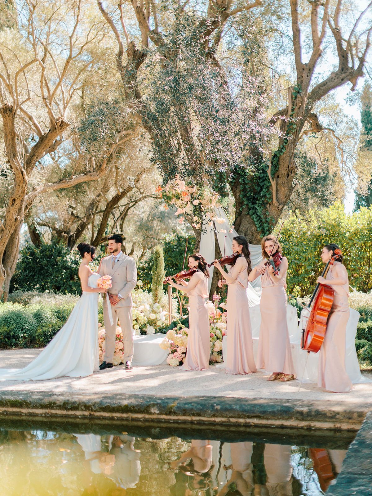The ceremony gathering beside the reflecting pool with musicians