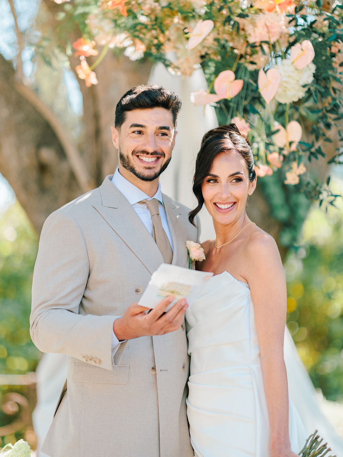 Bride and groom with their vow books at the altar
