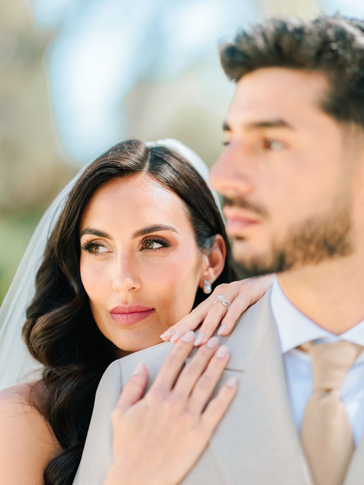 Bride resting against the groom's shoulder