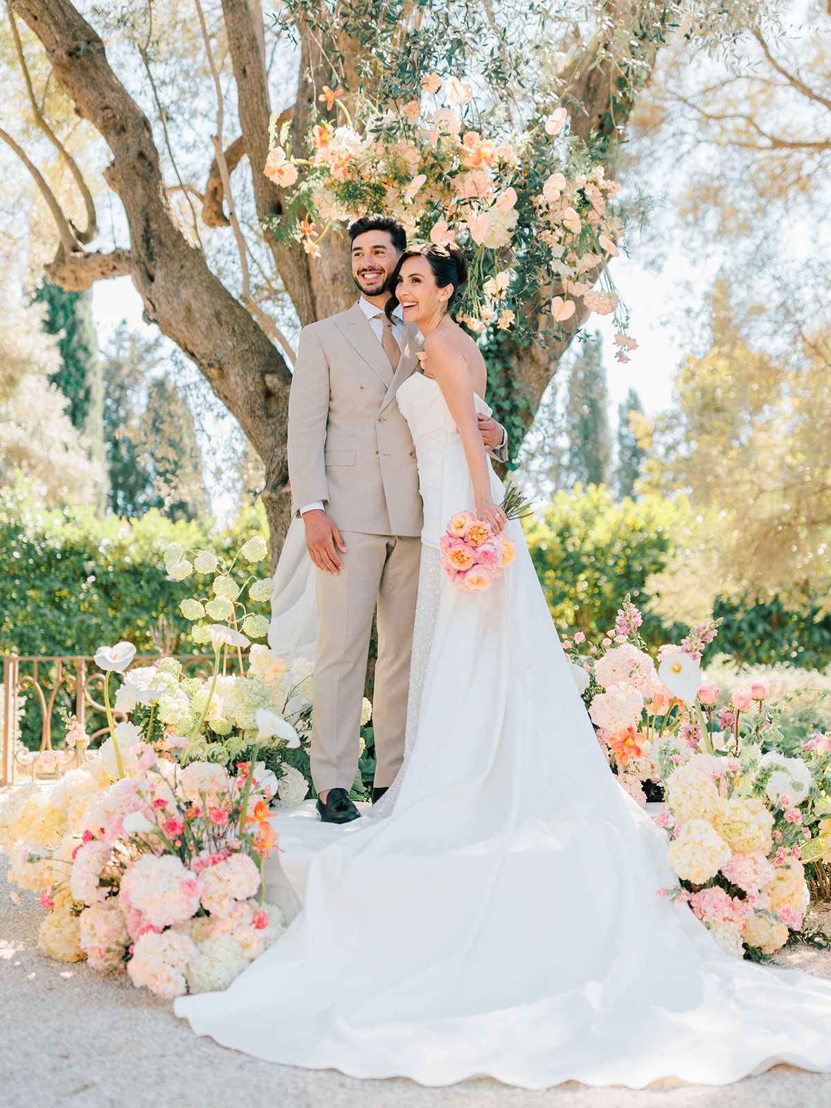 Bride and groom beside the floral installation