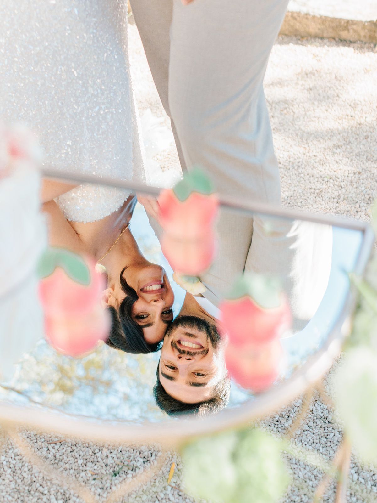 The couple reflected in a mirrored tray