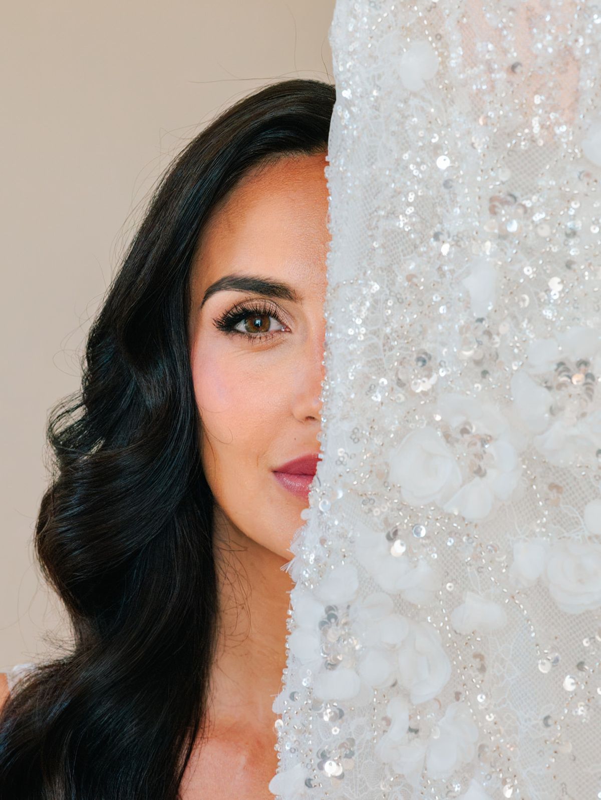 Bride beside the beaded bodice of her gown