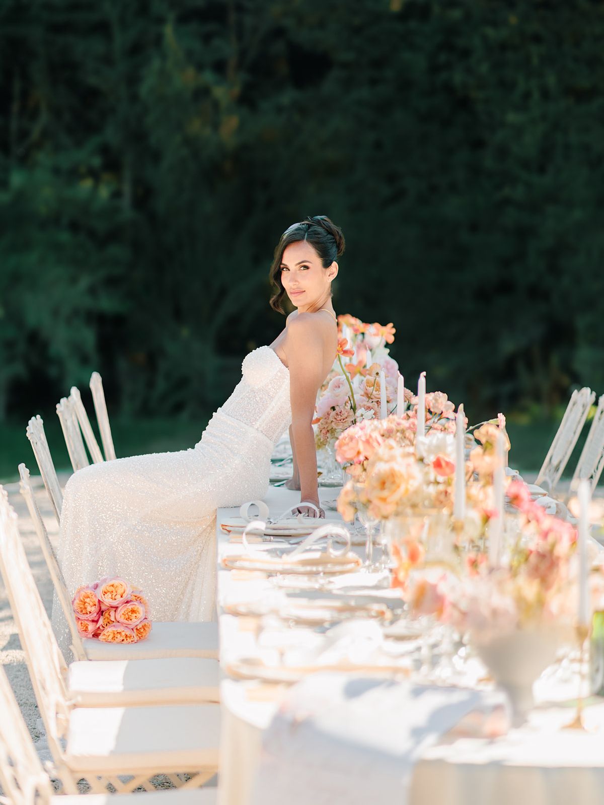 Bride seated at the candlelit table