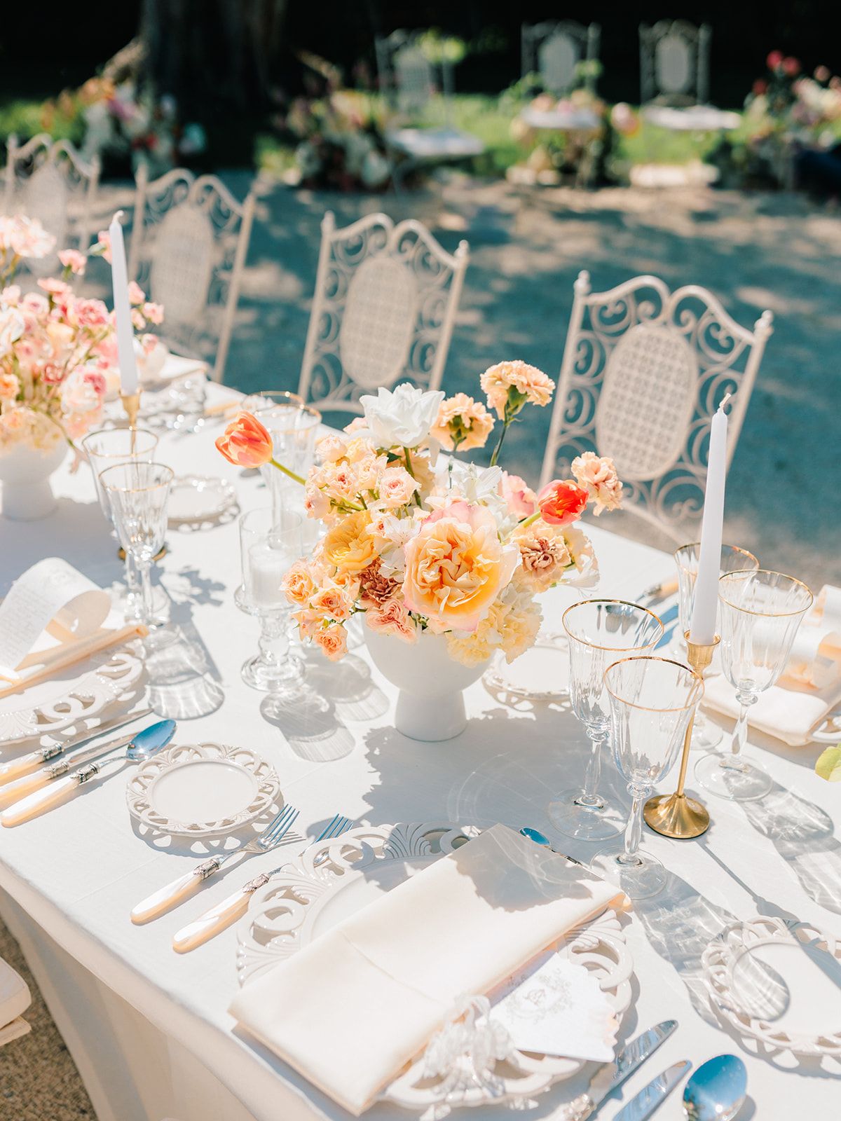 Garden table set with peach florals and painted chairs