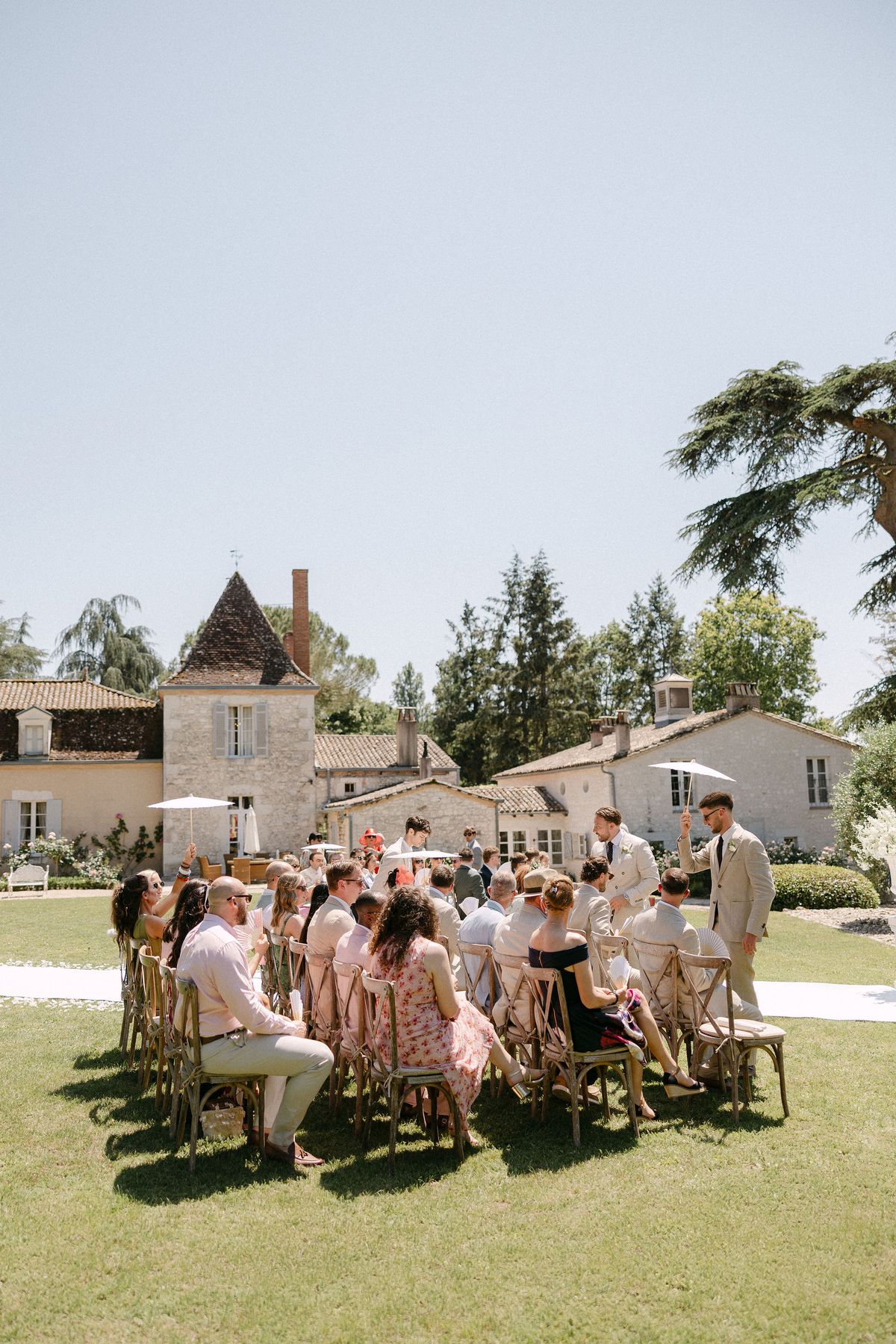 Guests seated for the outdoor ceremony at Château Lacanaud
