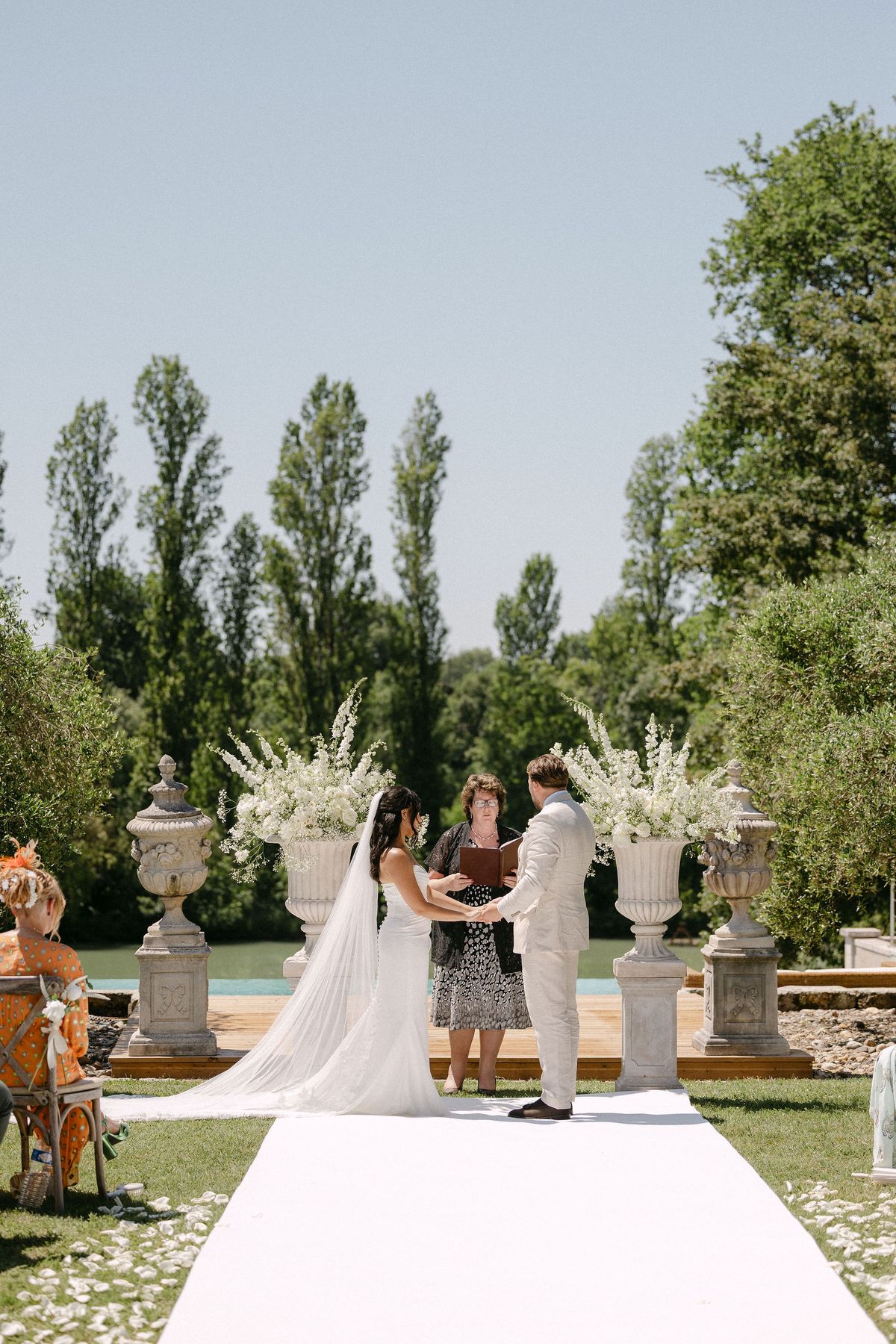 Couple exchanging vows at the altar with the celebrant