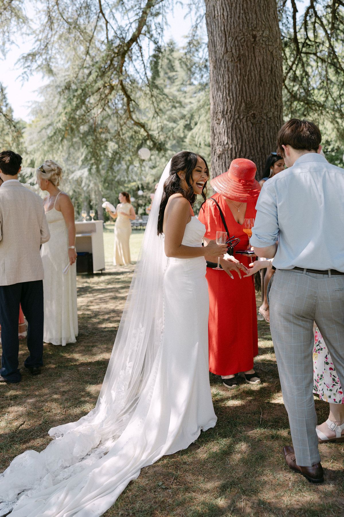 Bride greeting a guest during cocktail hour