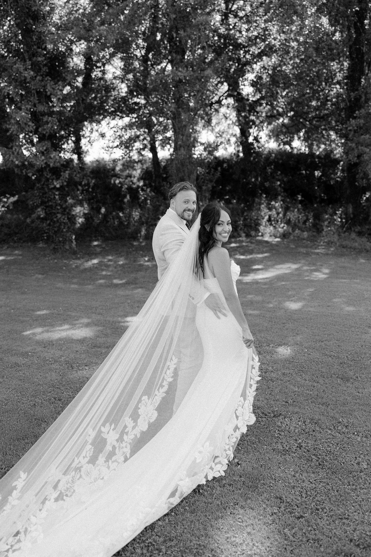 Black and white portrait of the couple embracing