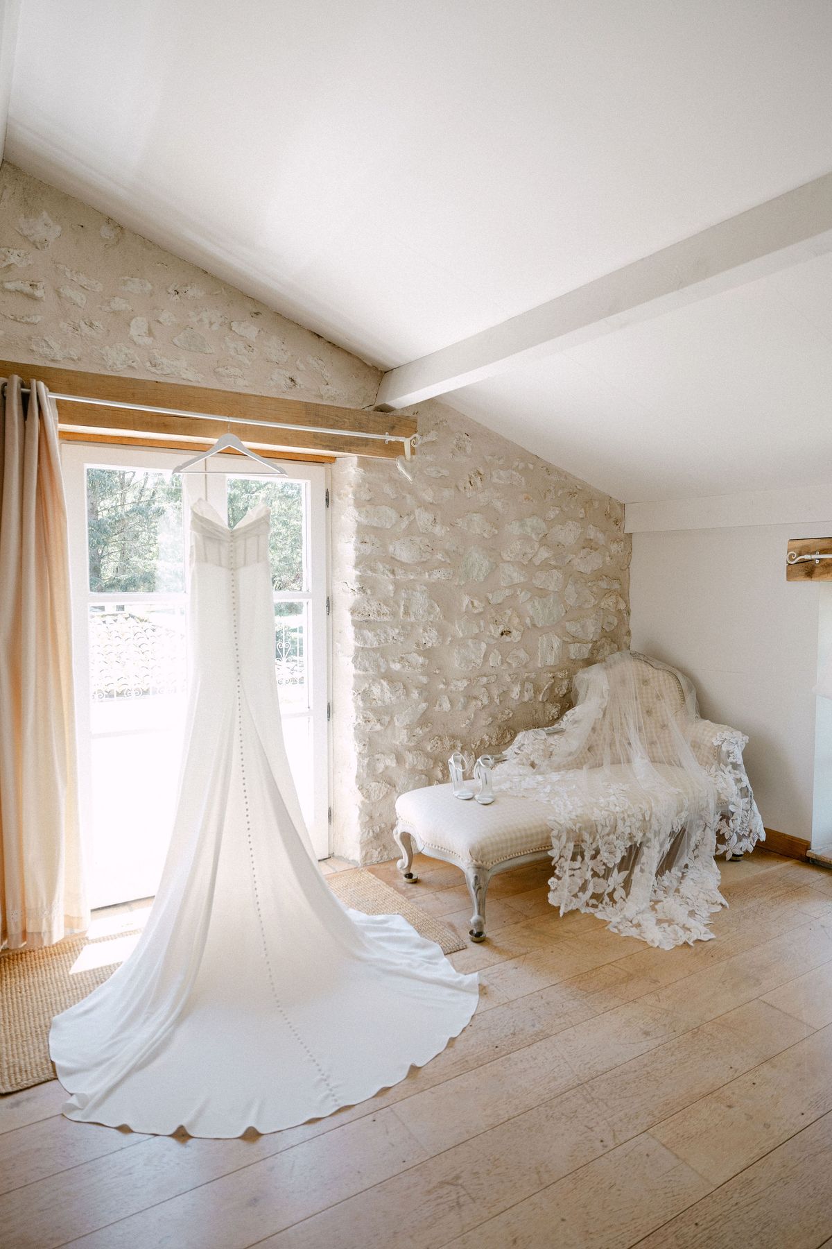Wedding dress on a hanger in the getting-ready room