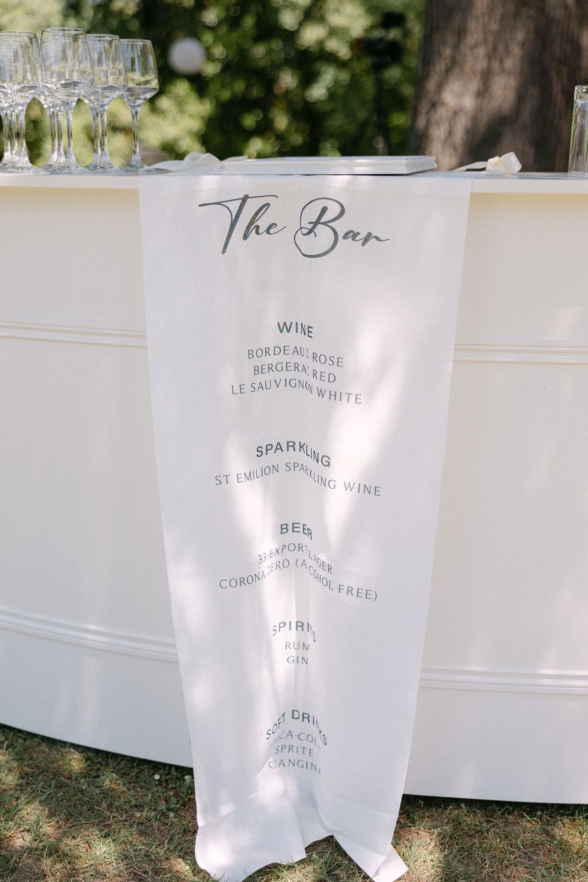 Drinks menu signage listing wine and cocktails