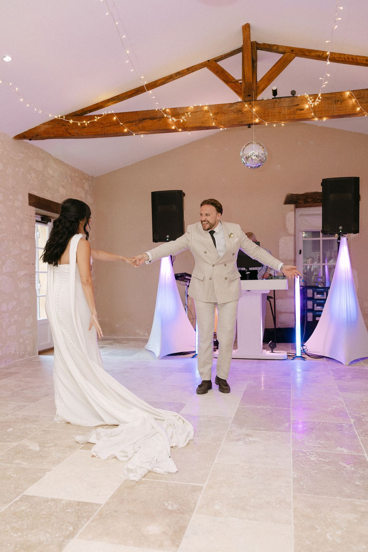 Bride and groom dancing together at the reception