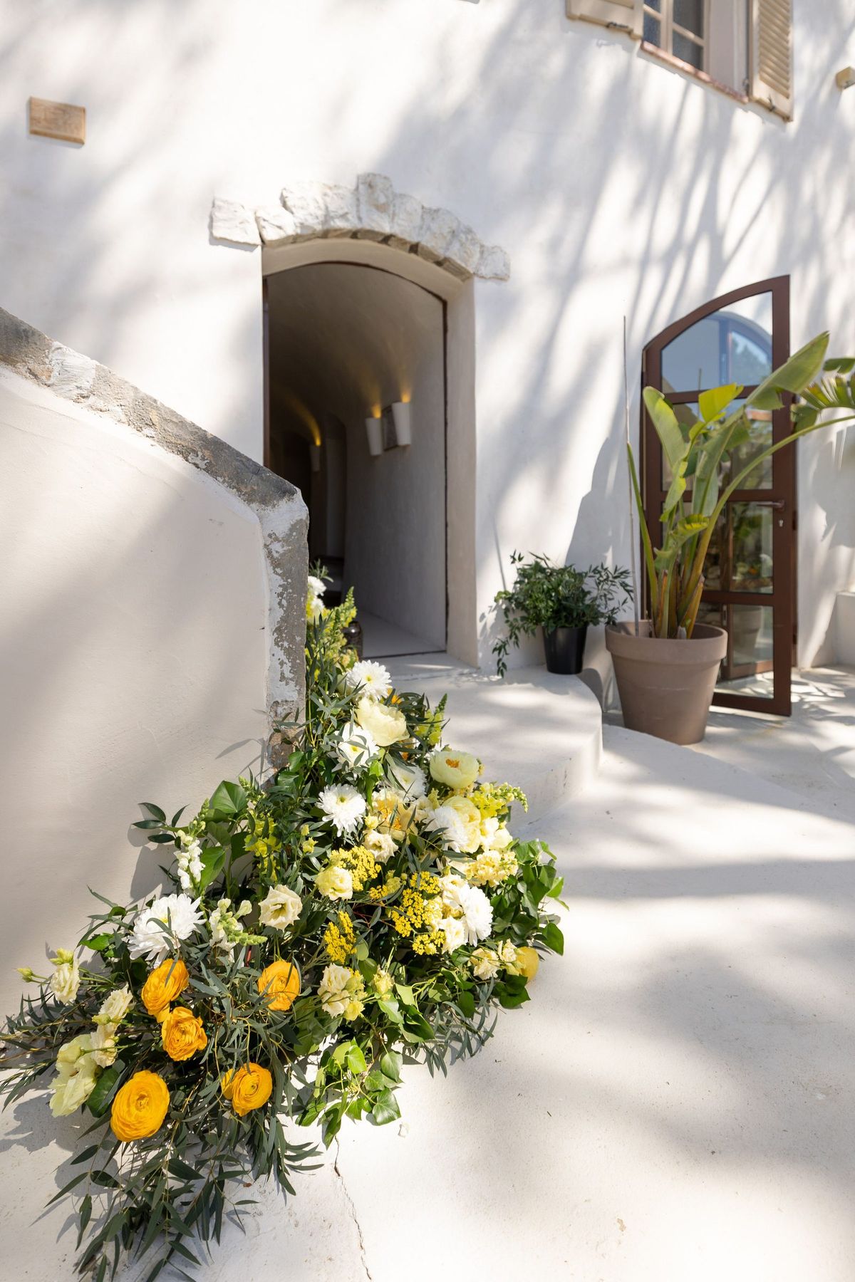 A courtyard with floral arrangements