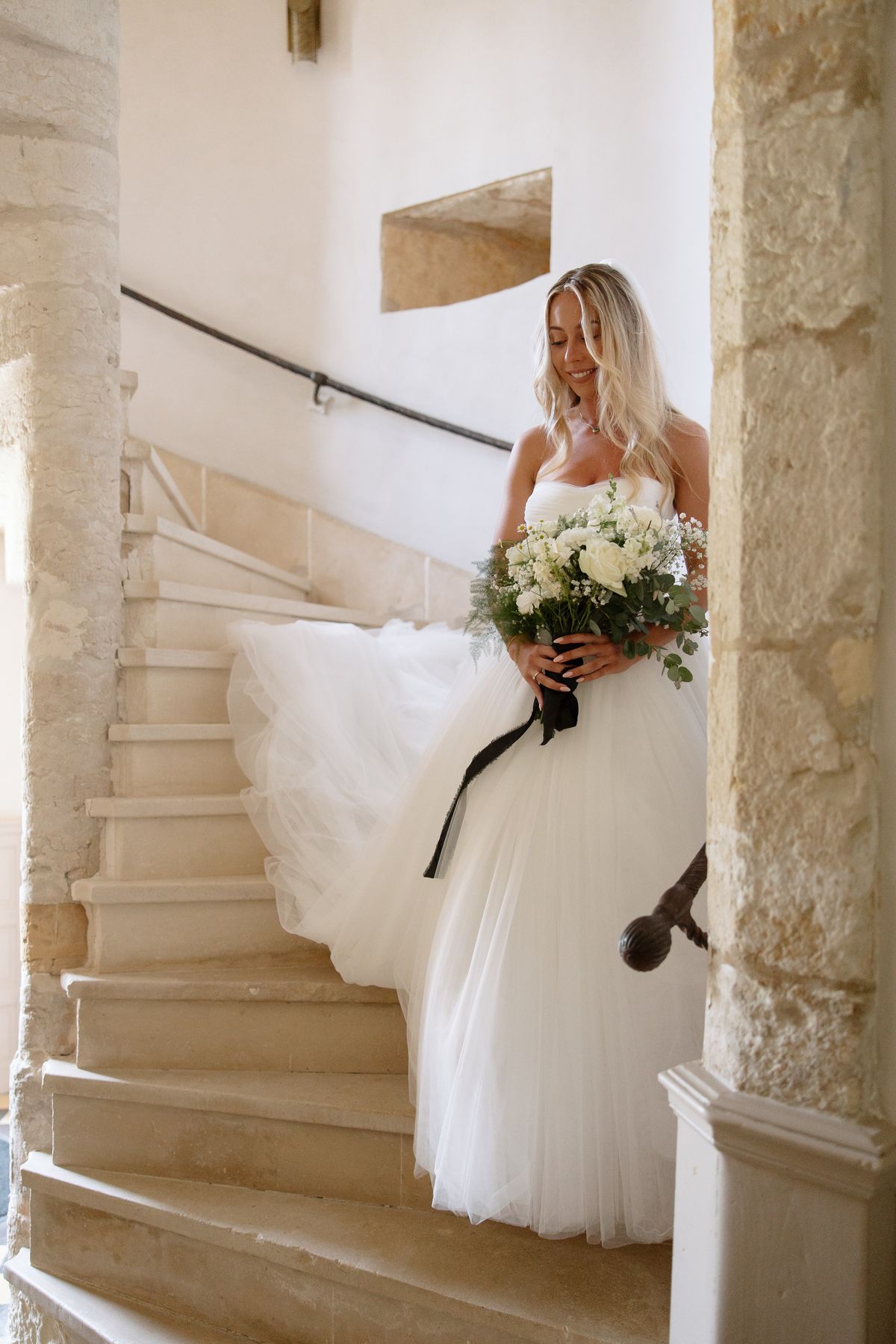 The bride in her Chosen by Khya gown at Chateau de Cazenac in the Dordogne