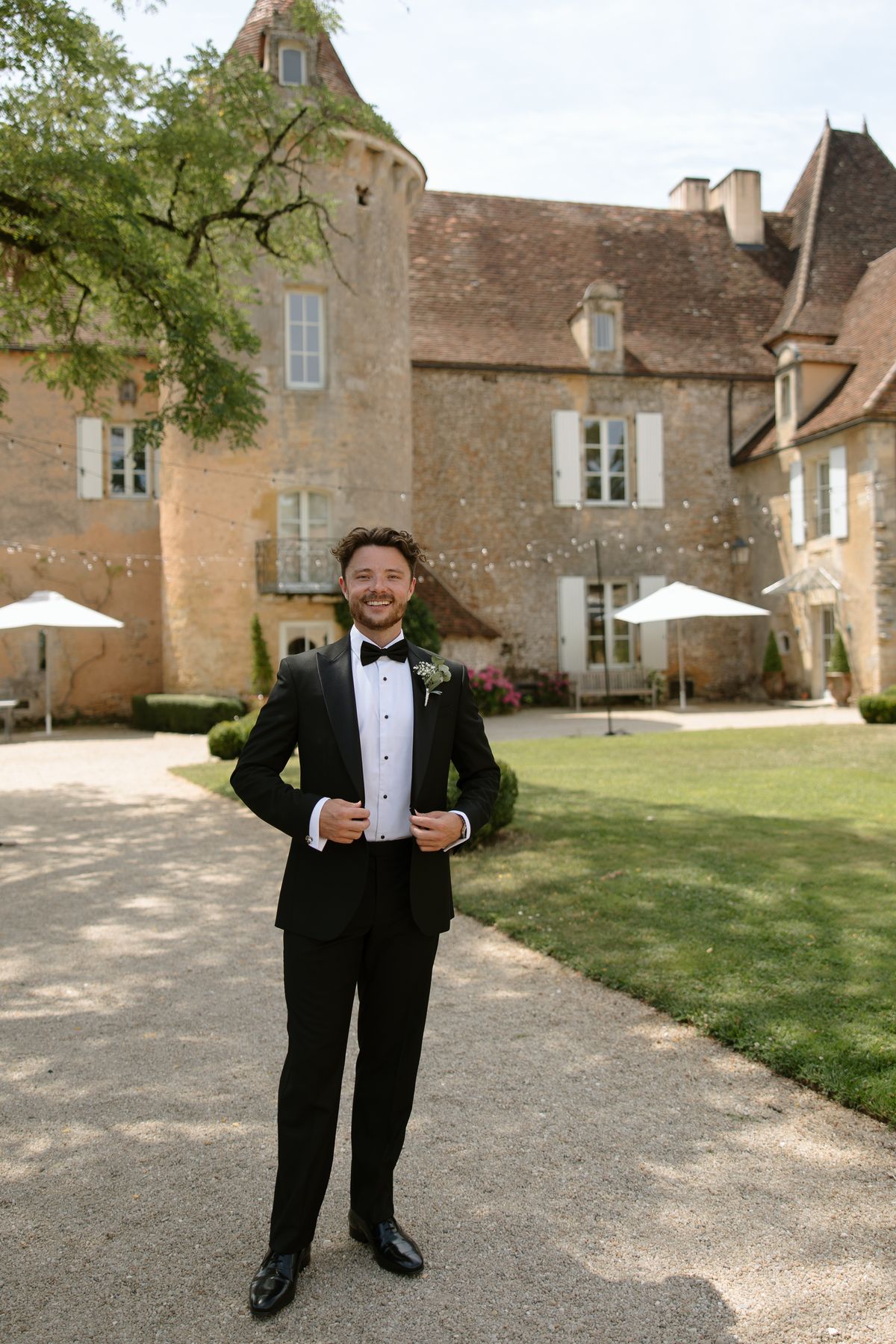 Amy and Oscar getting ready before their summer wedding at Chateau de Cazenac in the Dordogne