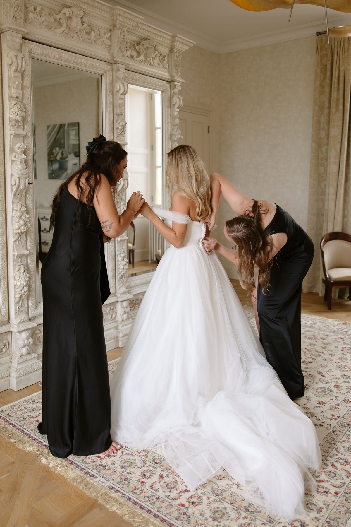 Amy and Oscar getting ready before their summer wedding at Chateau de Cazenac in the Dordogne