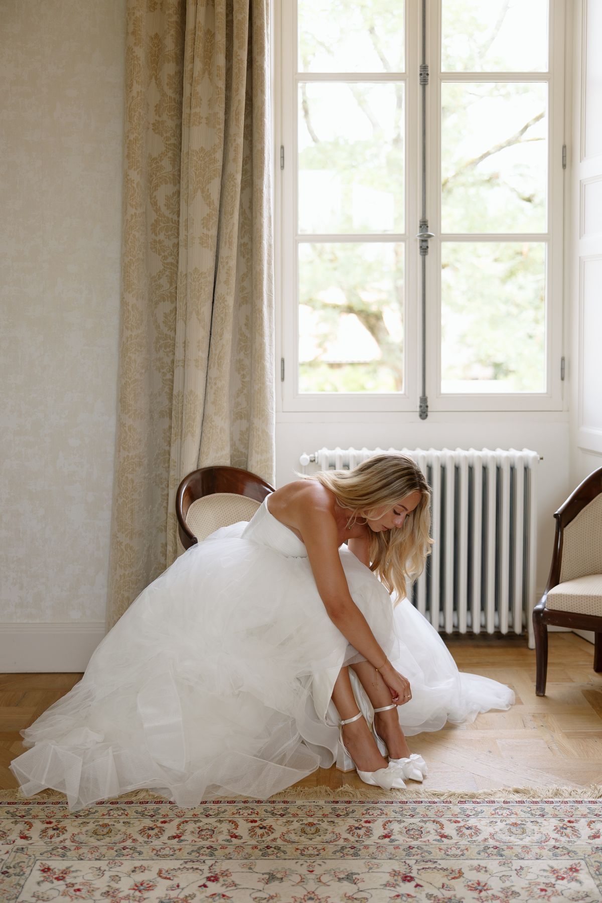 Amy and Oscar getting ready before their summer wedding at Chateau de Cazenac in the Dordogne