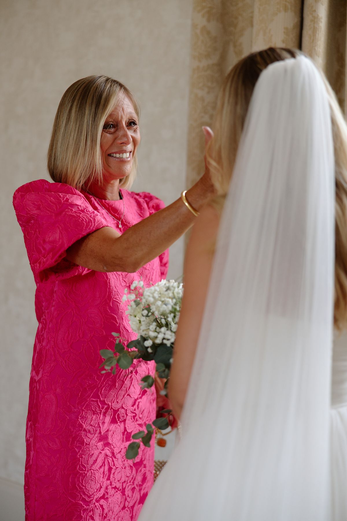Amy and Oscar getting ready before their summer wedding at Chateau de Cazenac in the Dordogne