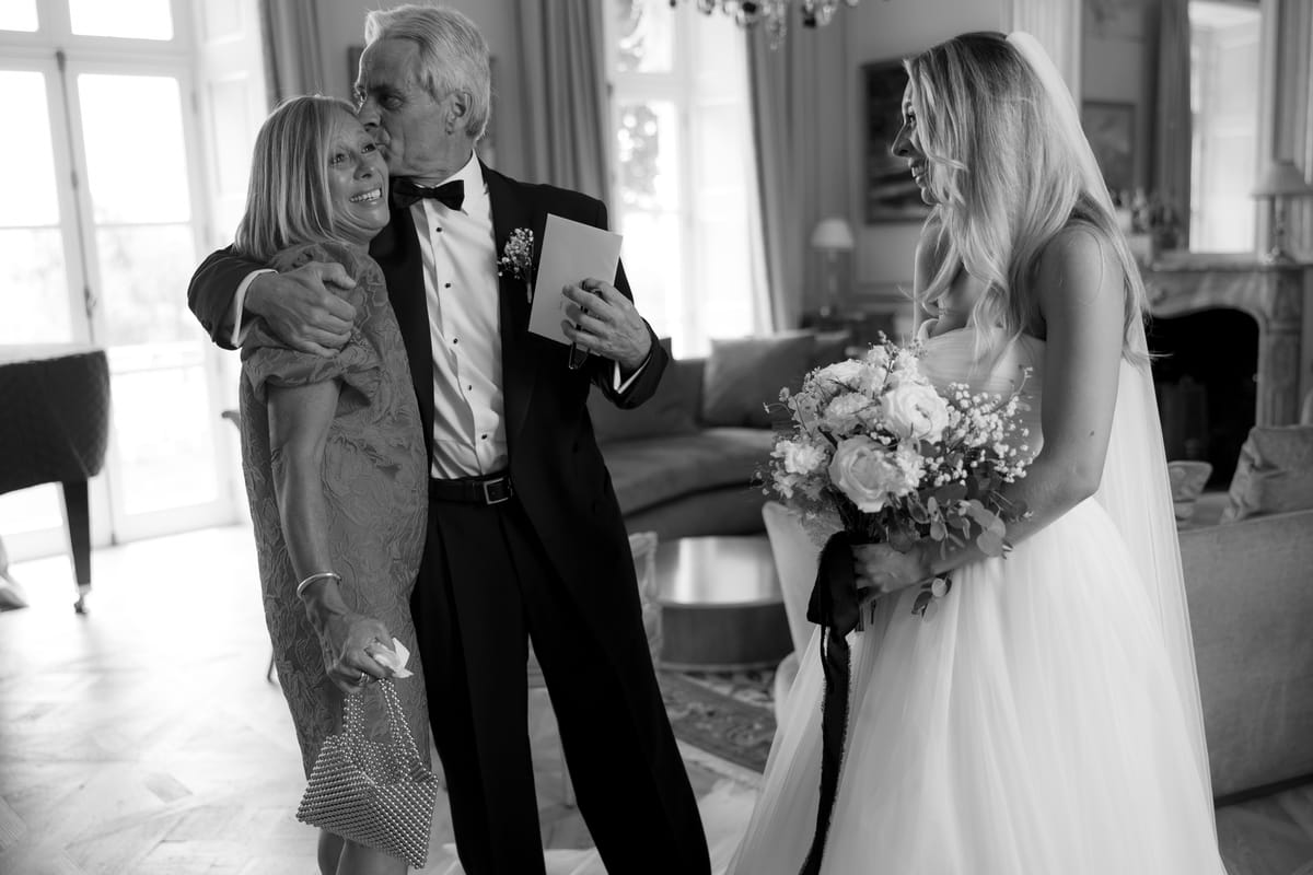 Amy and Oscar getting ready before their summer wedding at Chateau de Cazenac in the Dordogne