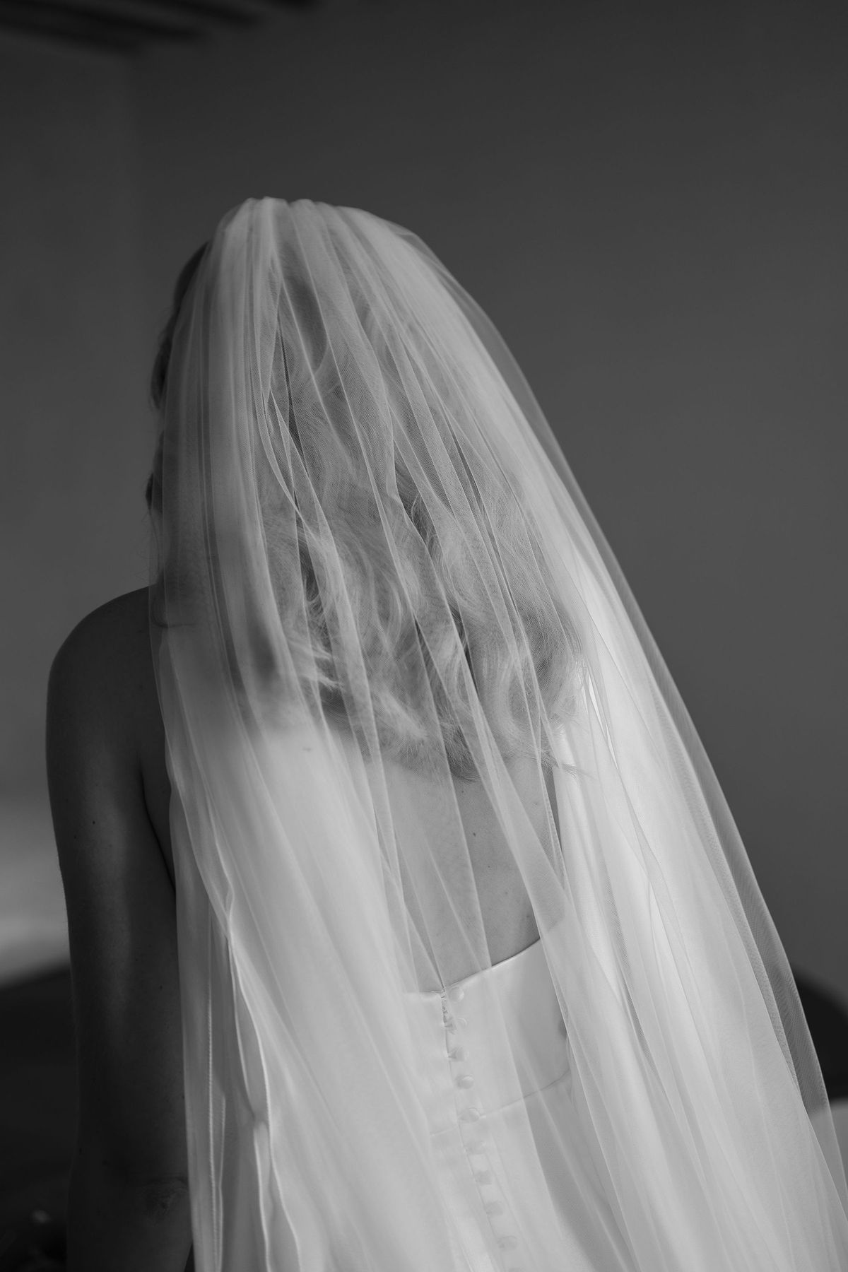 Black and white portrait of Louise beneath her full length veil