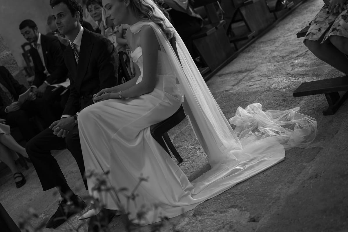 Black and white photograph of Louise and Lucas seated together during their church ceremony