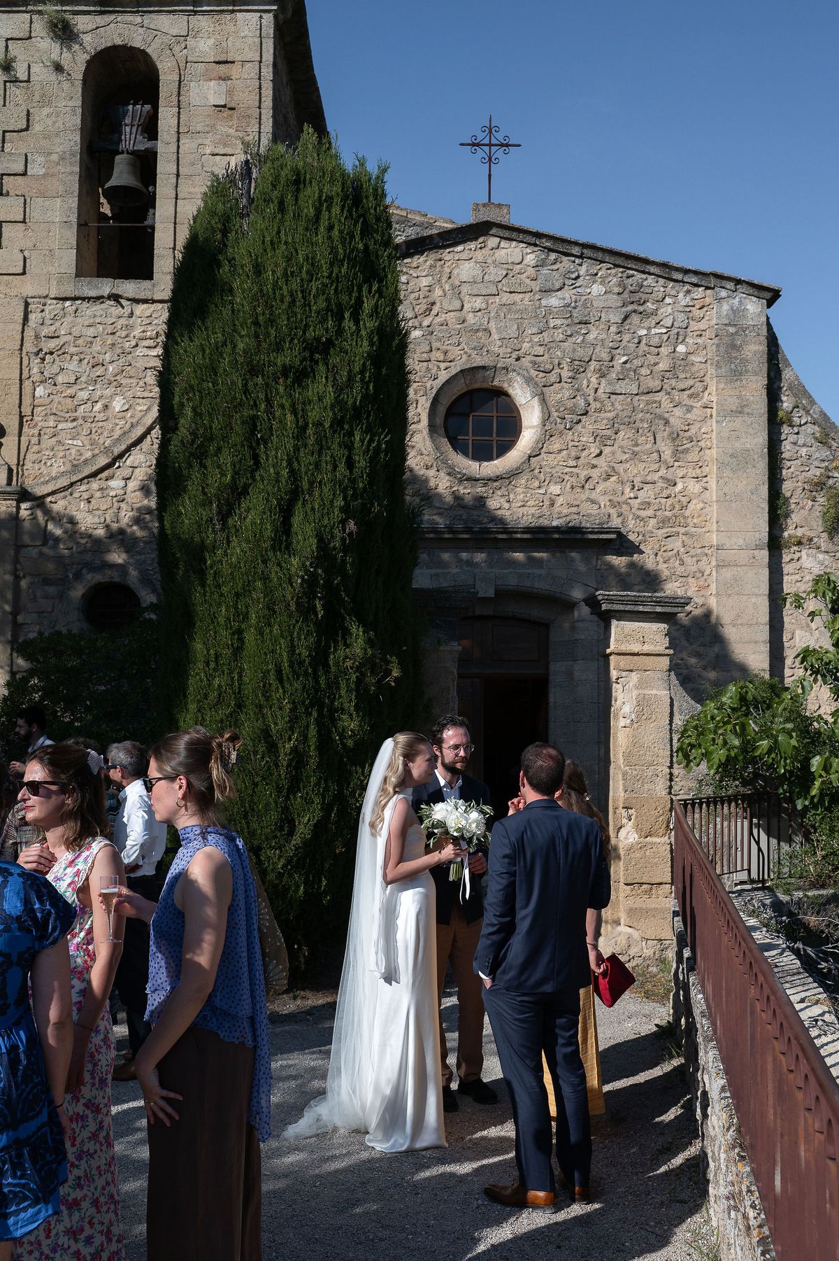 The stone village church and cypress trees where Louise and Lucas were married in Provence
