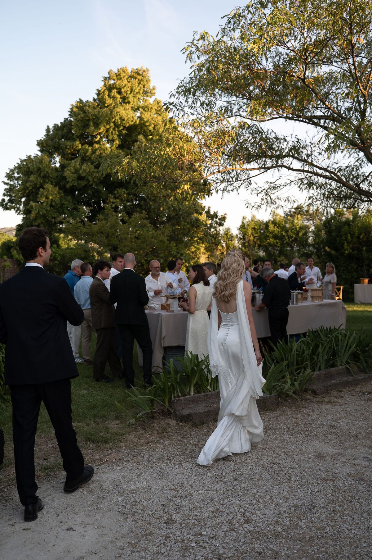 Louise and Lucas walking towards their guests in the garden