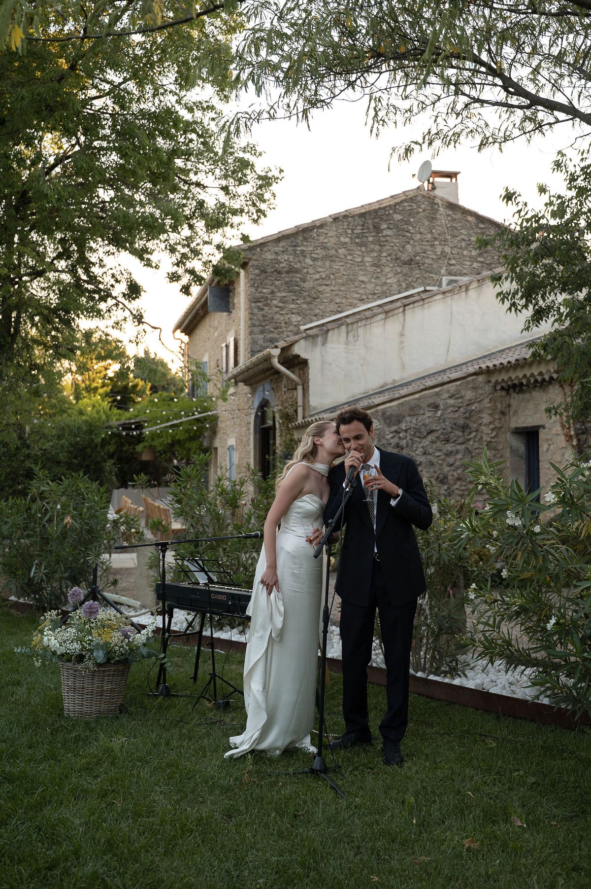 Louise and Lucas with drinks in the garden of her family home