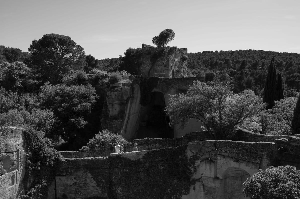 Black and white view of stone terraces and wooded hillside in the Luberon, Provence