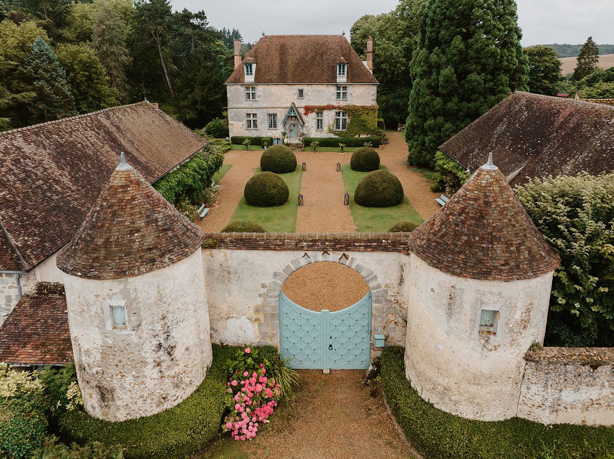 Aerial view of the manor's twin-towered gatehouse and forecourt
