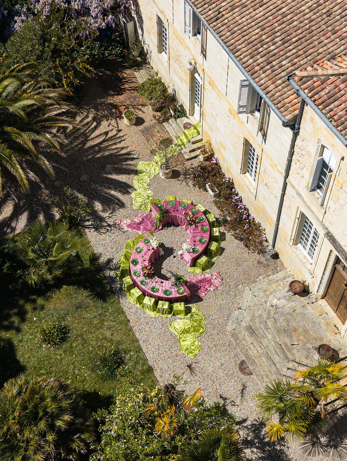 Aerial view of the chateau wing, gardens and the crescent reception tables