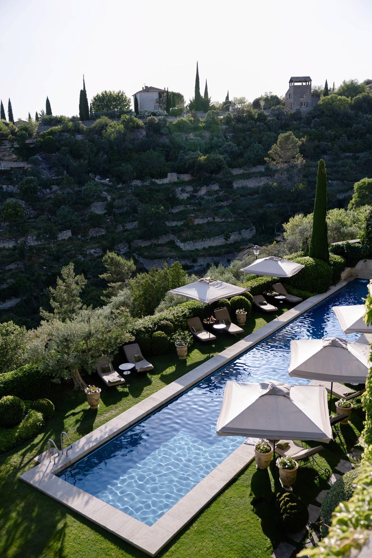 Pool terrace with parasols on the hillside