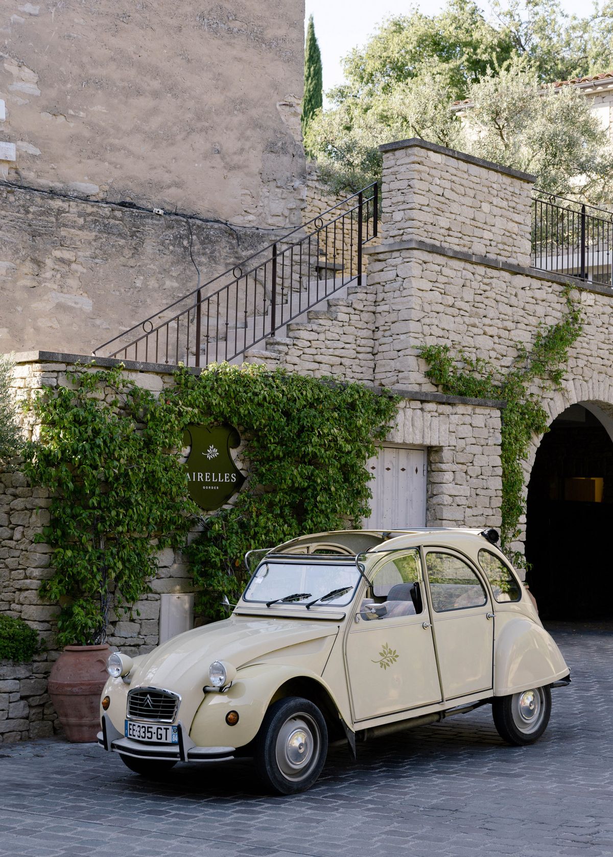 Vintage 2CV parked outside the hotel entrance