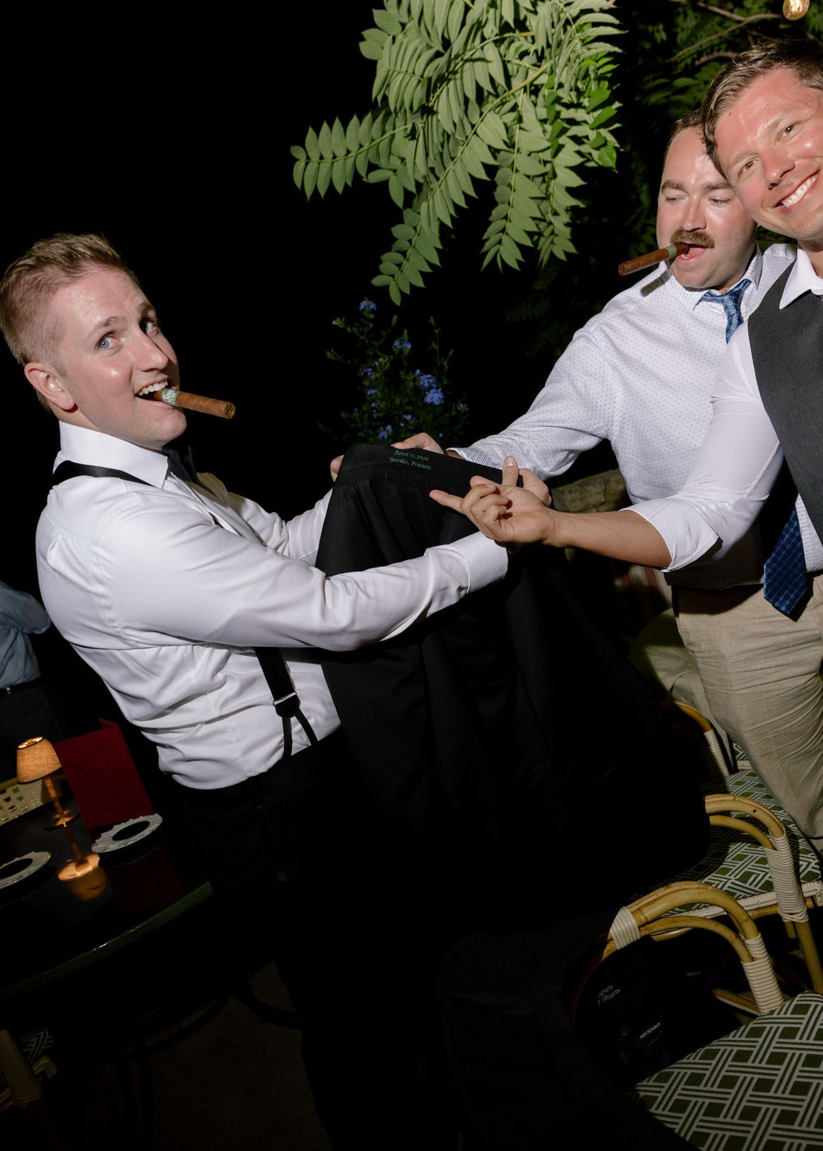 Groom and friends with cigars
