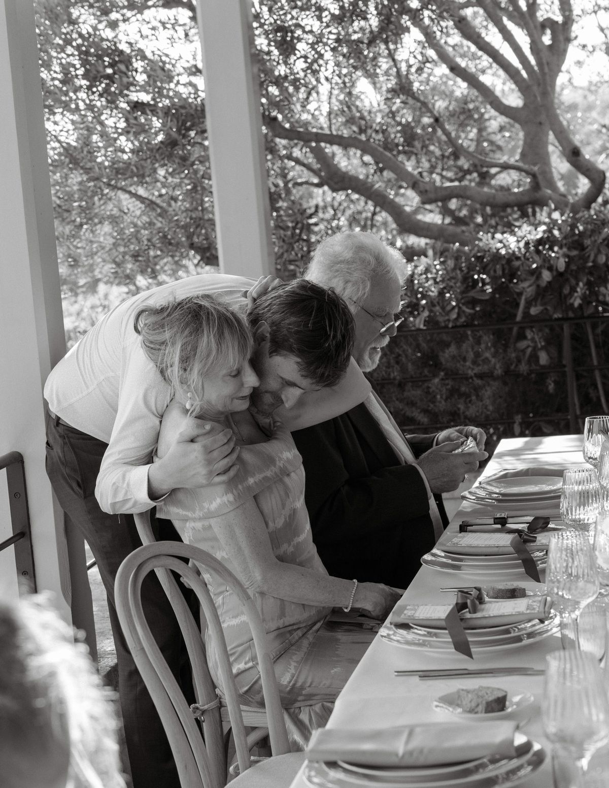 Black and white photo of guests at the dinner table