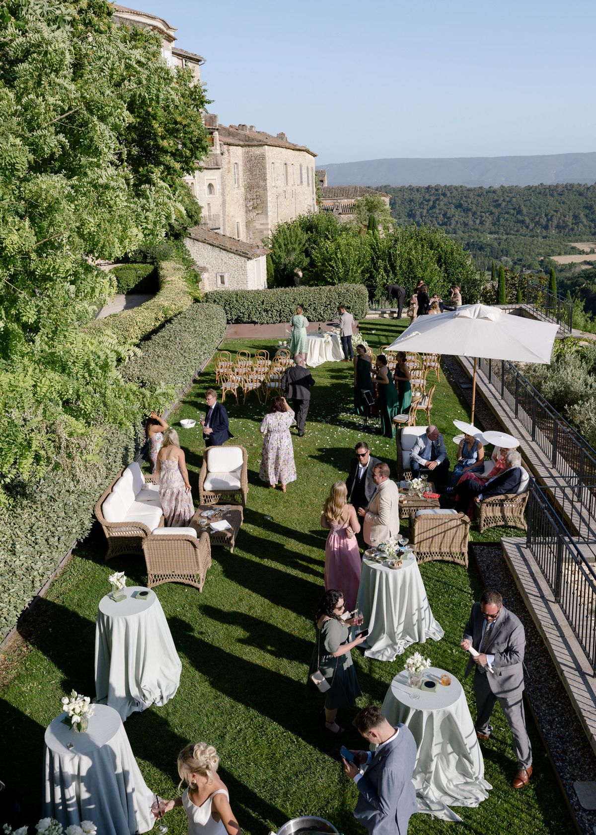 Guests gathered on the lawn terrace for drinks