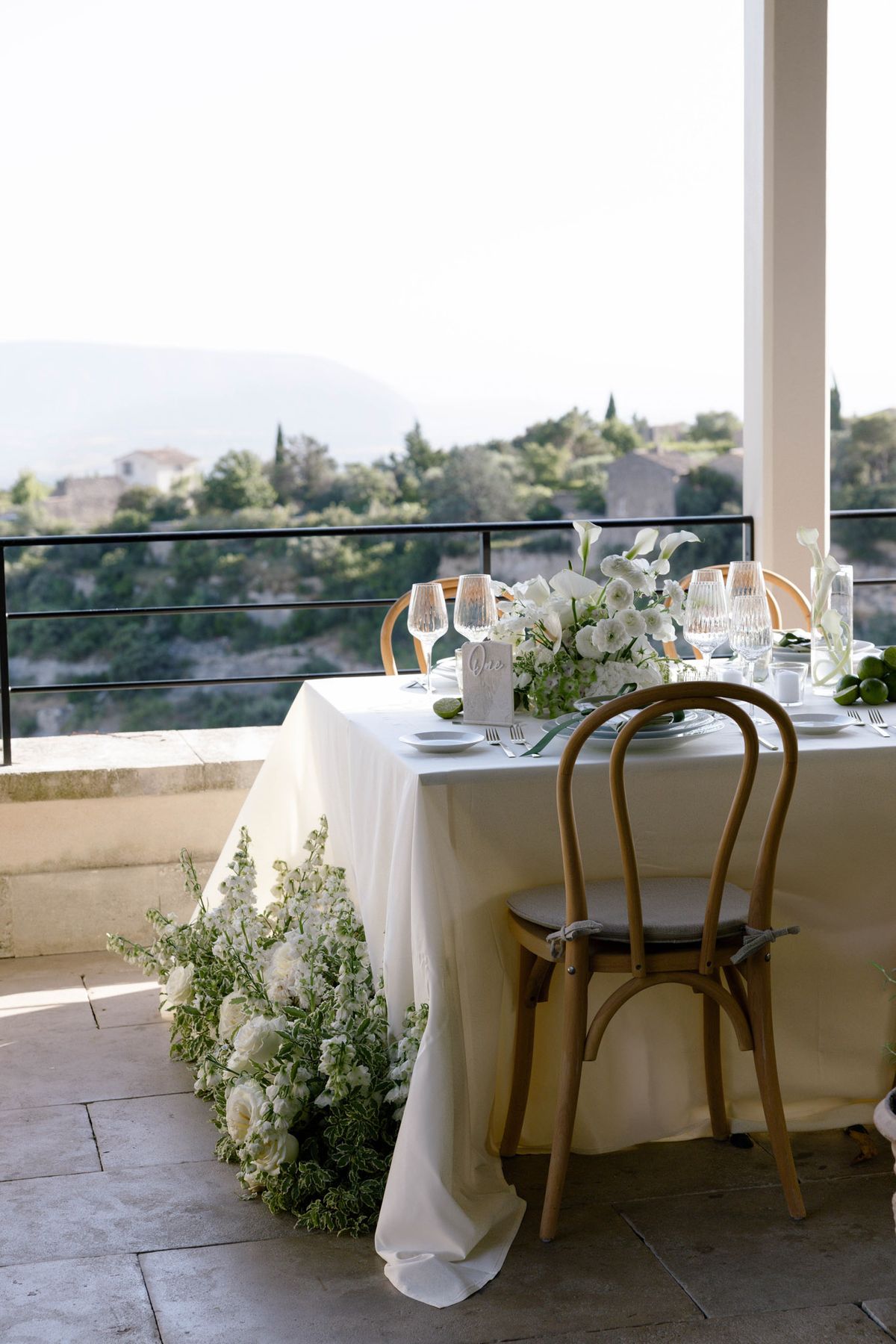 Table set on a terrace overlooking the hills