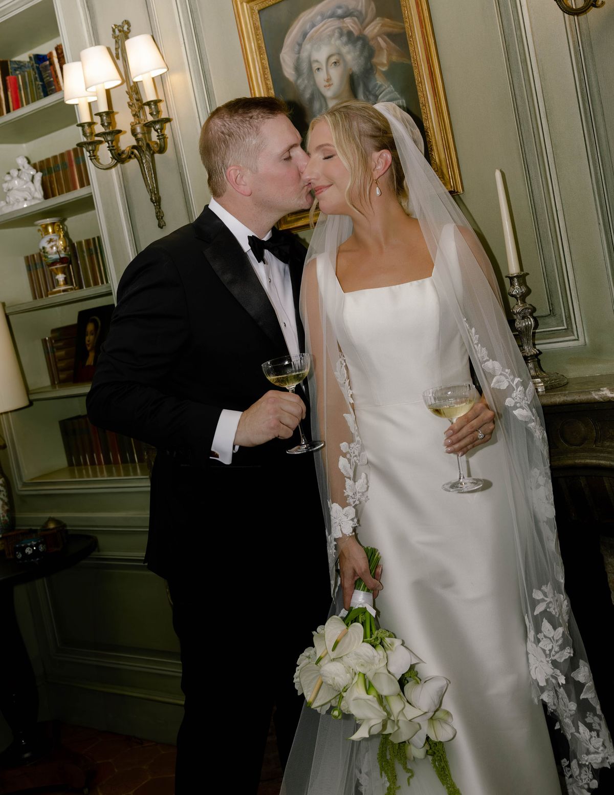 Kirstin and Ryan kissing in a panelled library