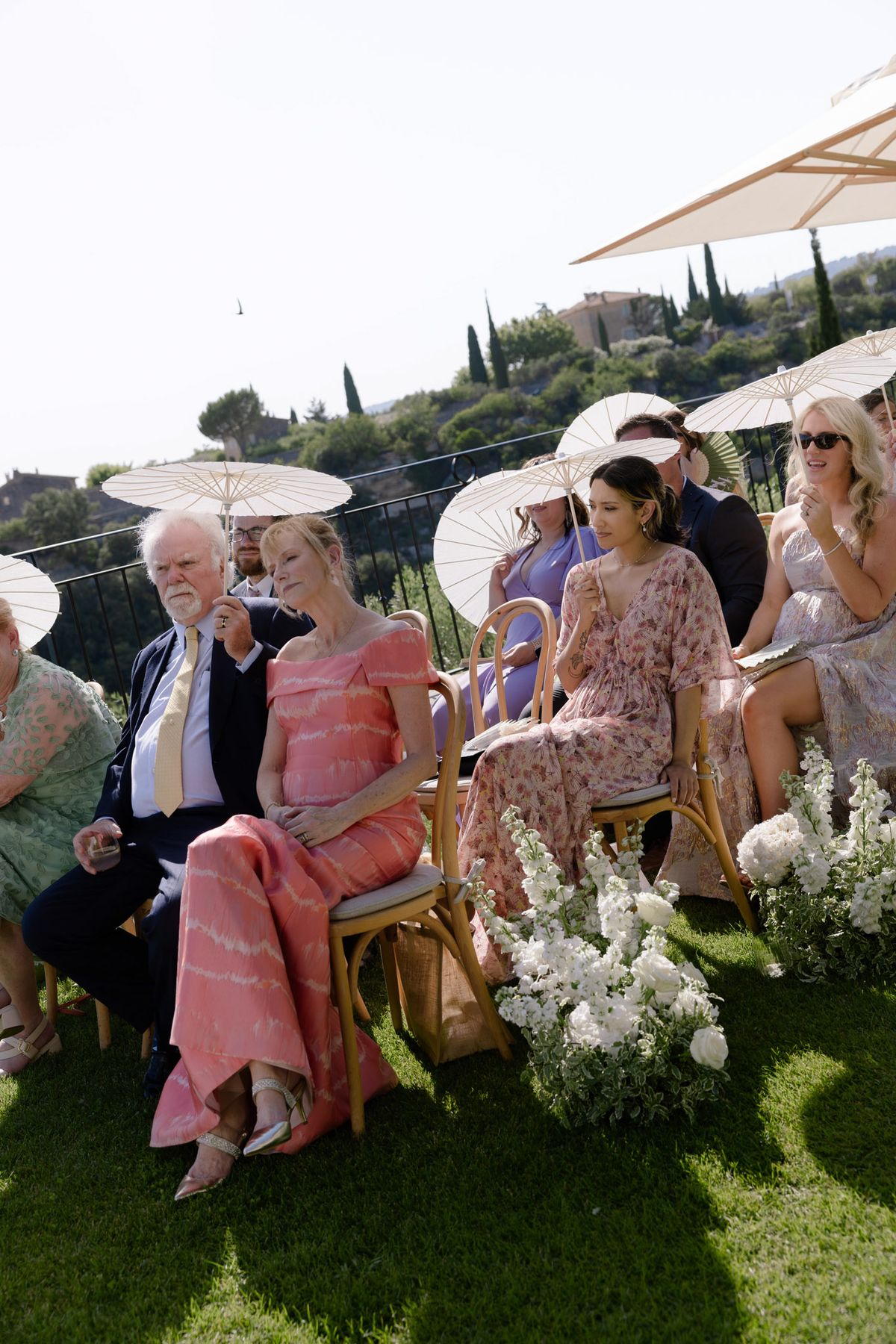 Guests watching the ceremony from their chairs