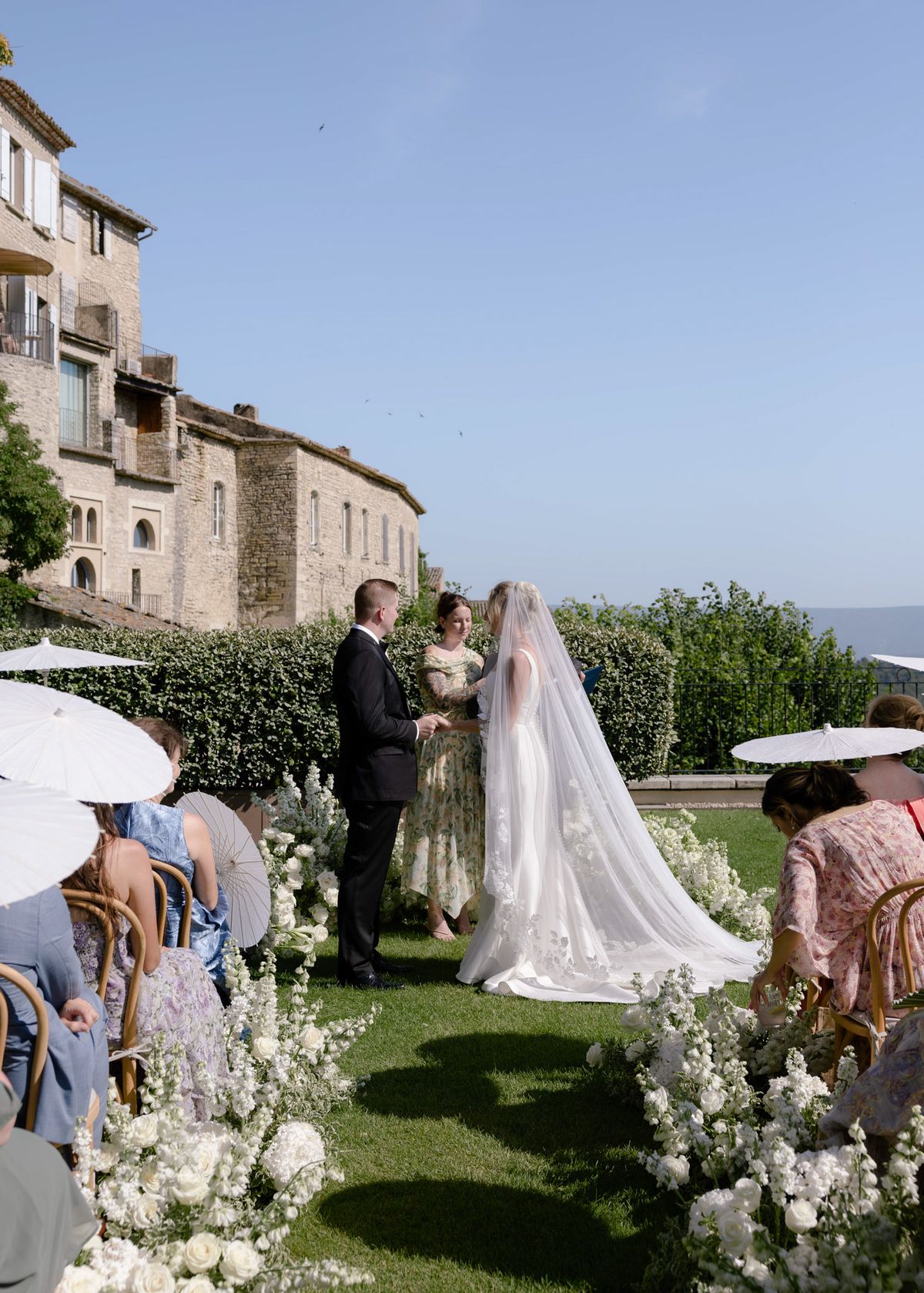 Kirstin and Ryan at the altar with the valley behind