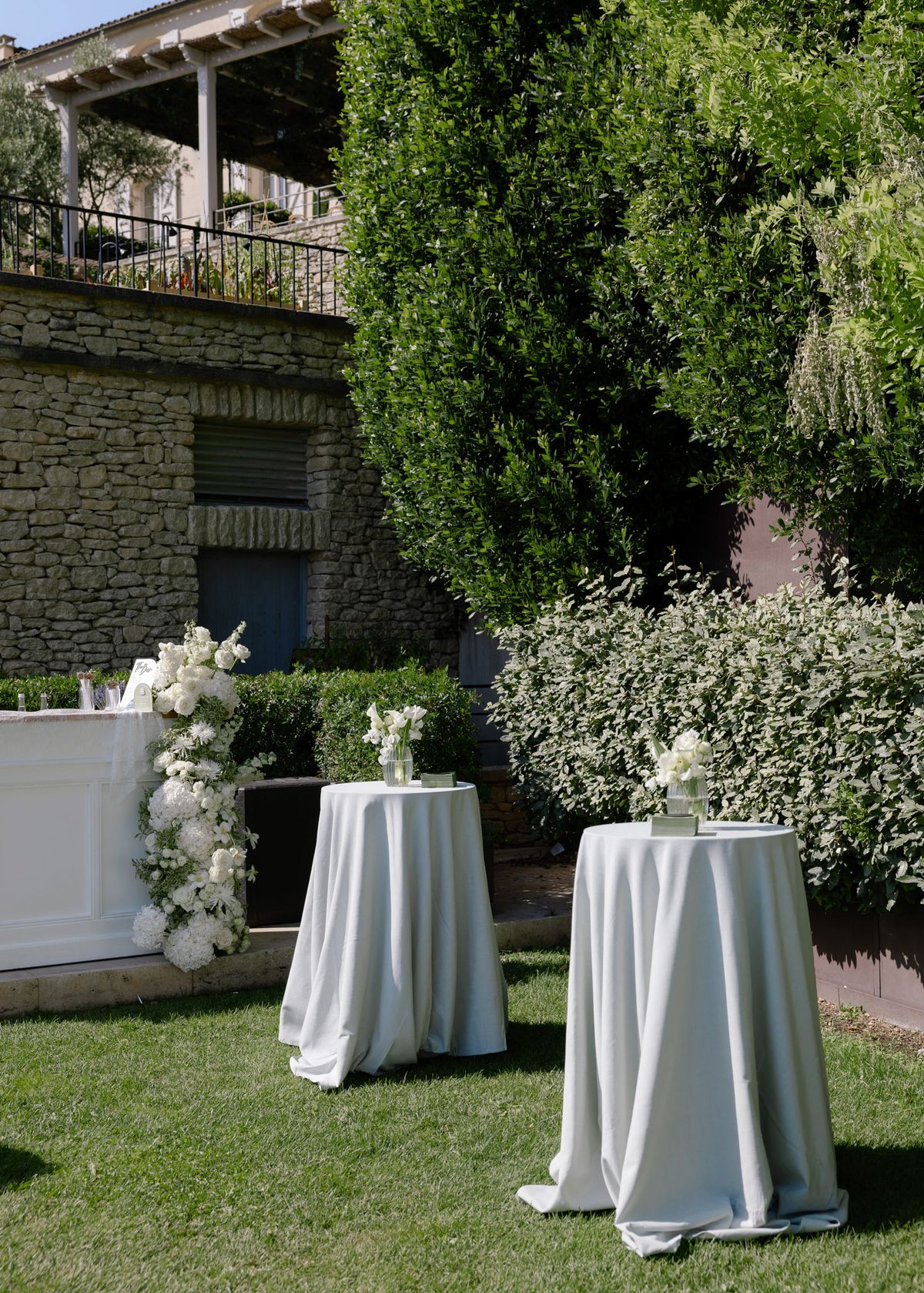 Cocktail tables in pale linen on the lawn