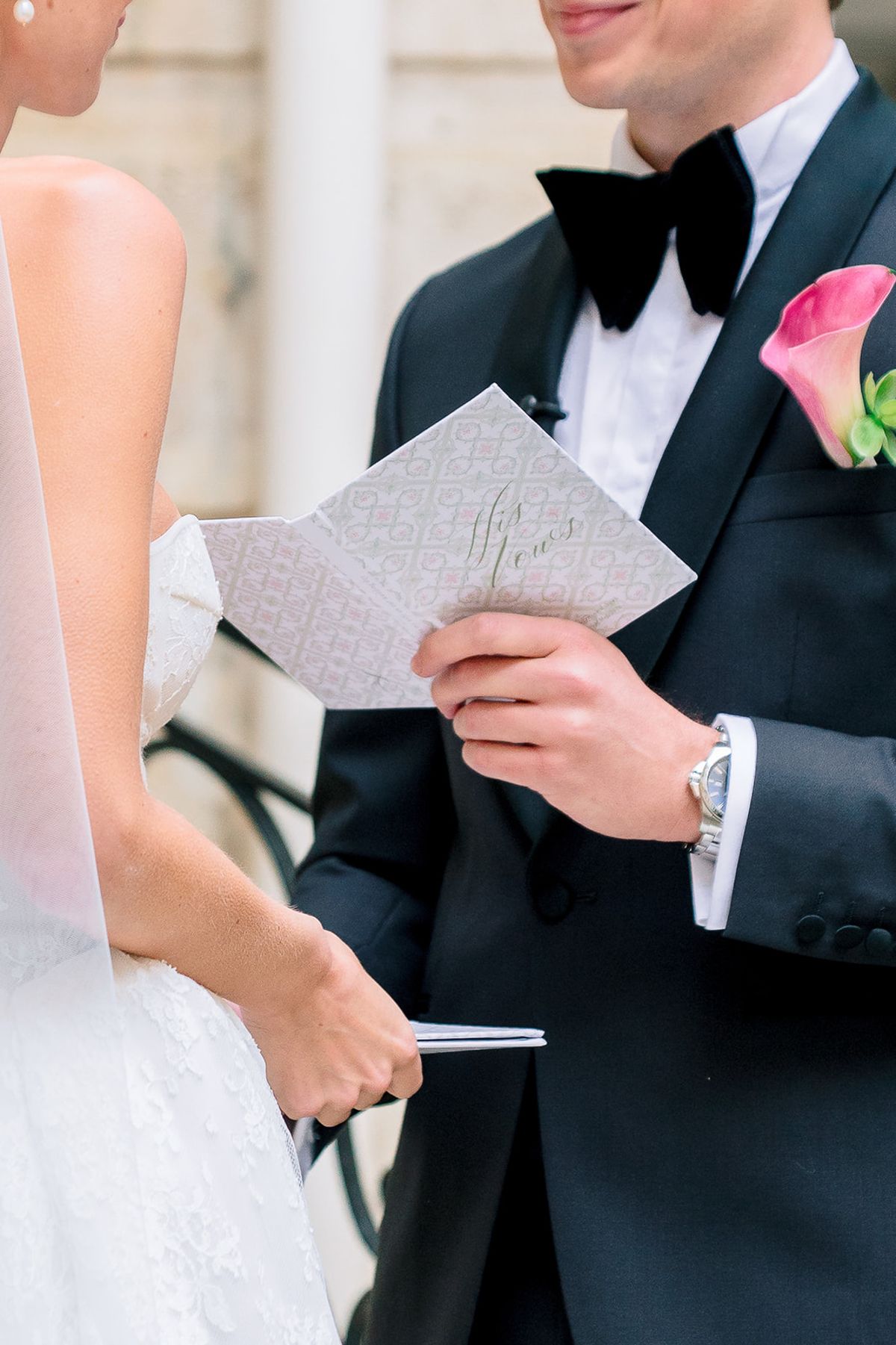 Bride and groom reading their vows in the courtyard at Hôtel Alfred Sommier
